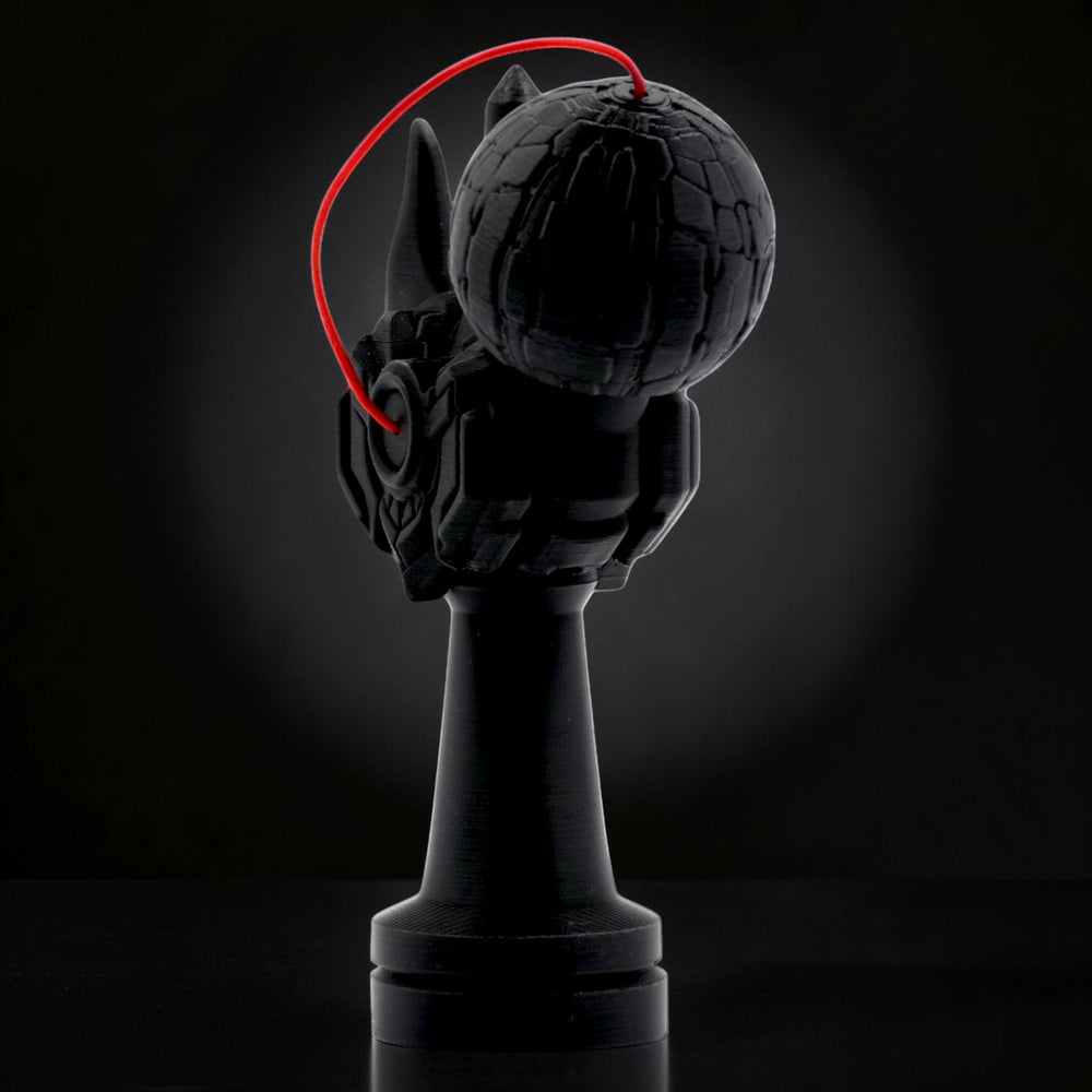 Tom Go Kendama Geeker Iron M, black, with intricate detailing on the cup and a red string.