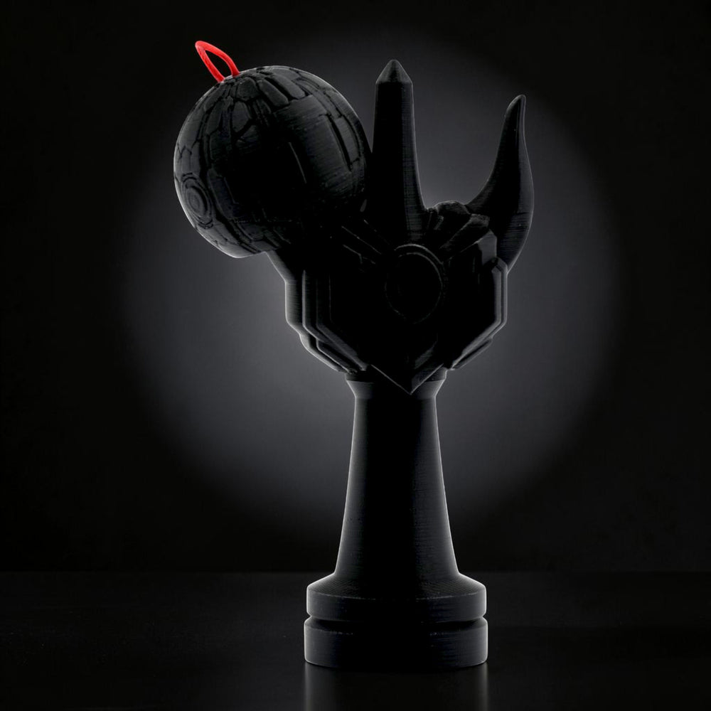 Tom GO Kendama Geeker Iron M black kendama with a red string, featuring a unique armored design.