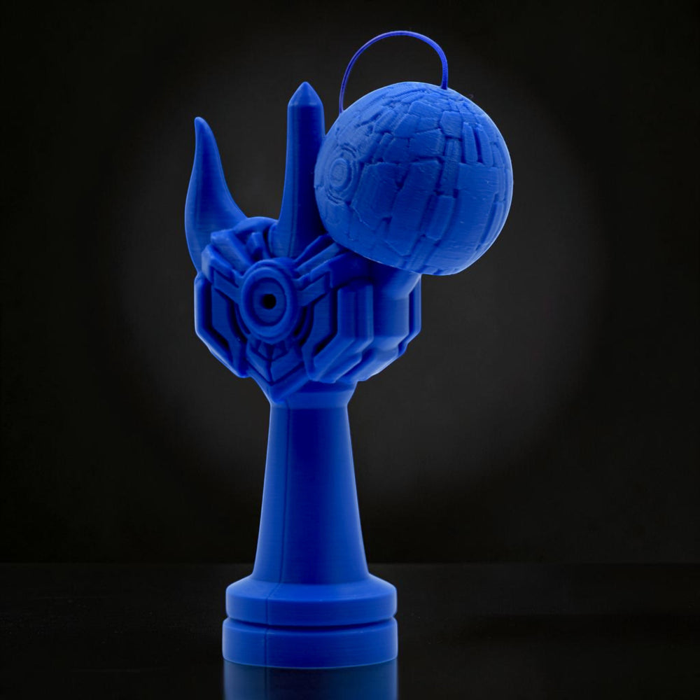 Tom Go Kendama Geeker Iron M, a blue kendama with a unique, angular design resembling armor and a textured tama.