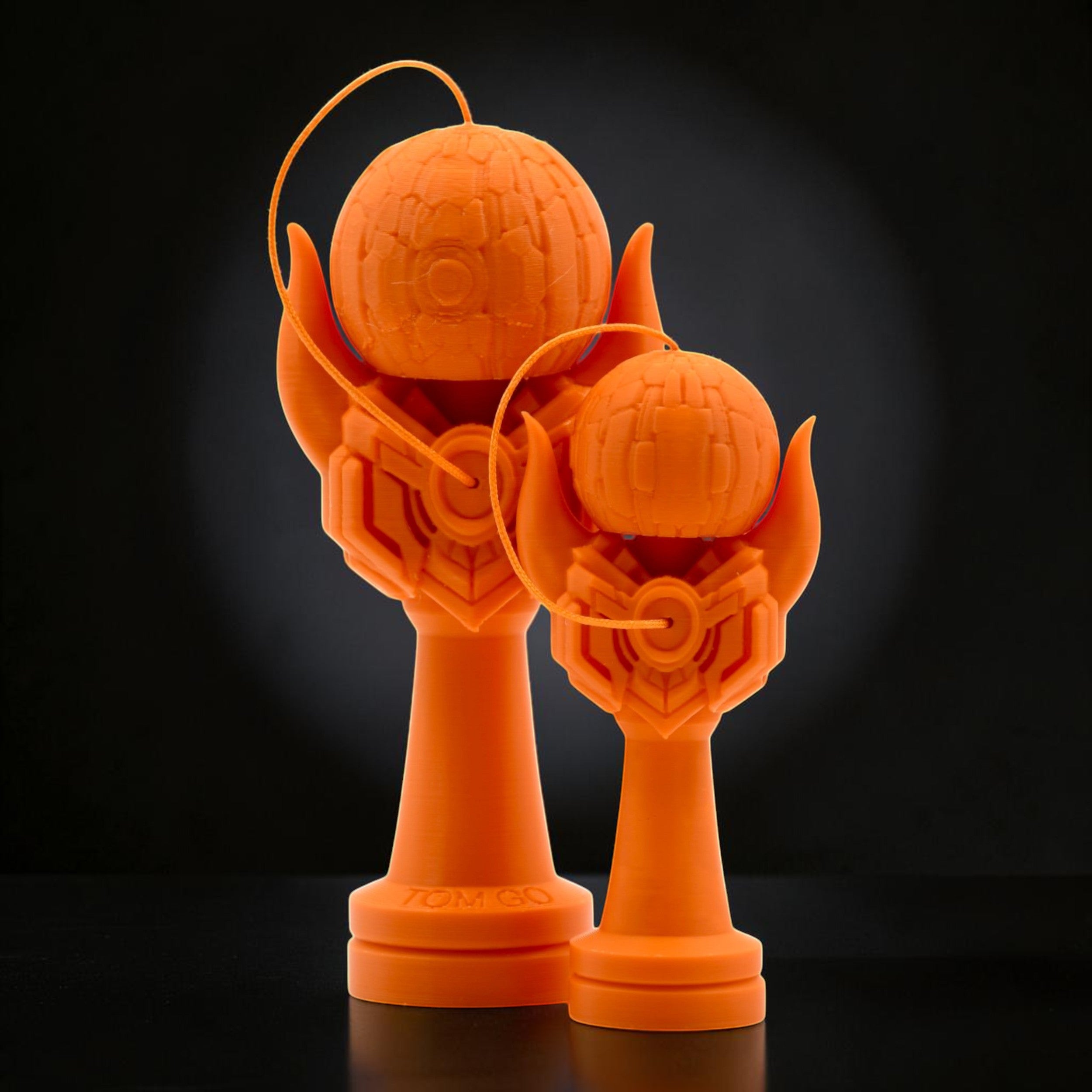 Tom GO Kendama Geeker Iron M, orange, with intricate detailing on the cup and tama, designed for precision play.