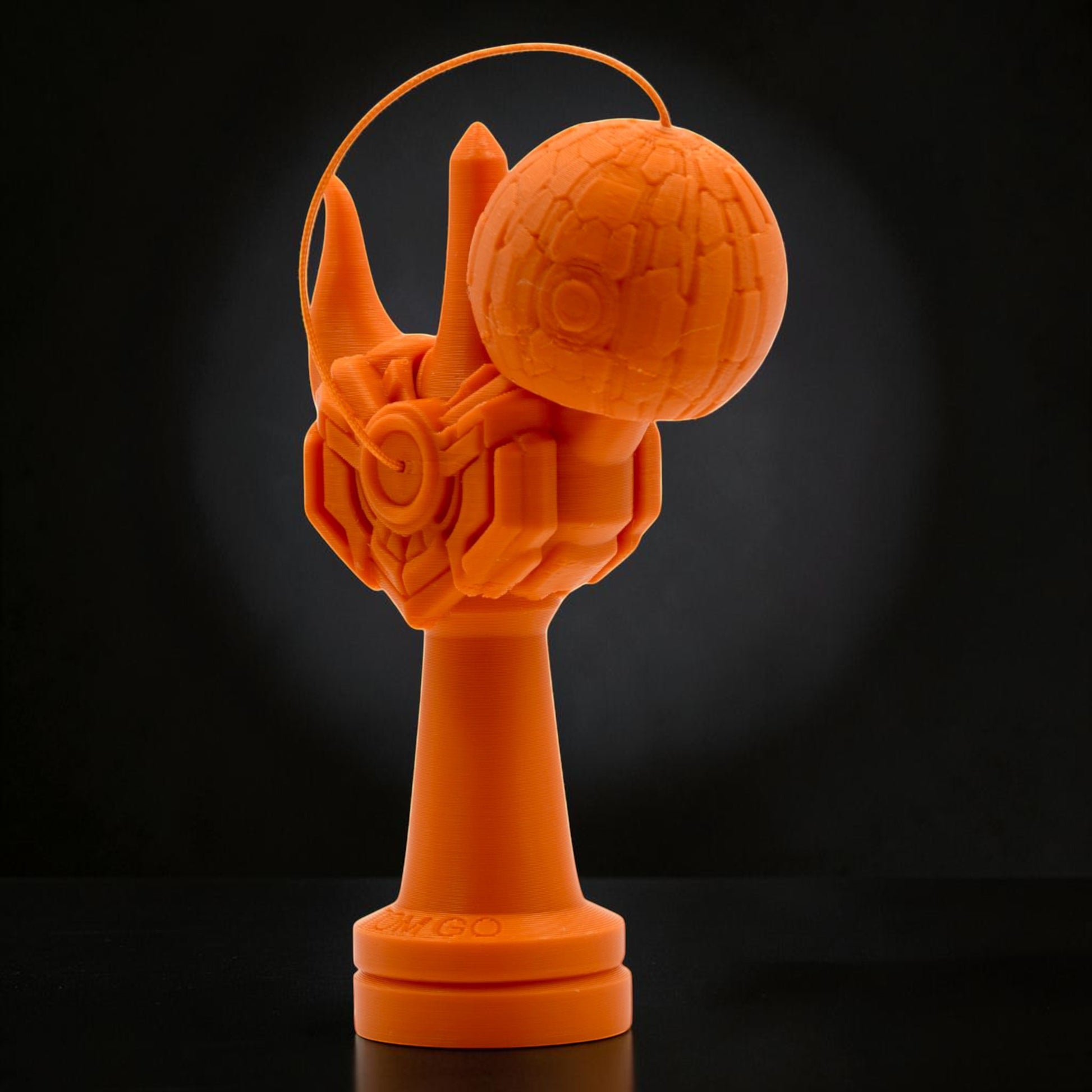 Tom GO Kendama Geeker Iron M, orange, 3D printed, with intricate mechanical details and a textured tama.