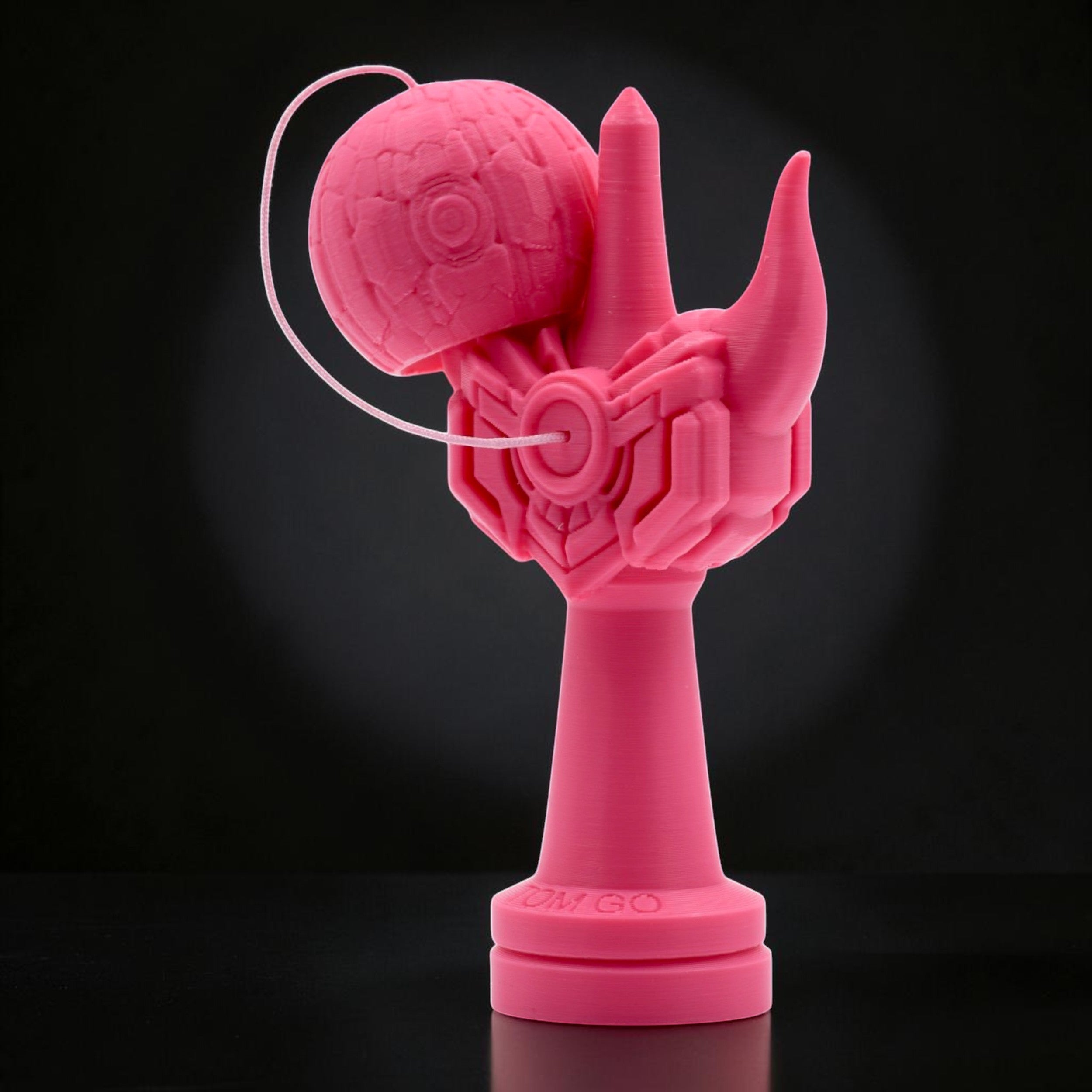 Tom GO Kendama Geeker Iron M, a bright pink 3D printed kendama with a unique, robotic, armored design and a textured ball.