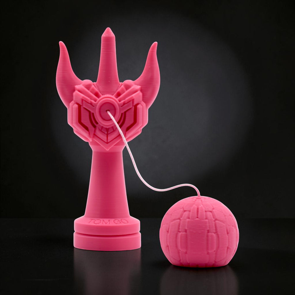 Tom GO Kendama Geeker Iron M, a bright pink, uniquely designed kendama with a stylized, almost robotic handle and a textured tama ball. The kendama is made of a matte material.