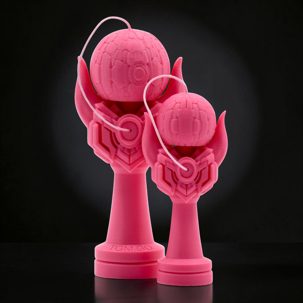 Tom GO Kendama Geeker Iron M, a bright pink 3D printed kendama toy with a unique, futuristic design. Features a textured tama and a stylized cup with intricate geometric patterns.