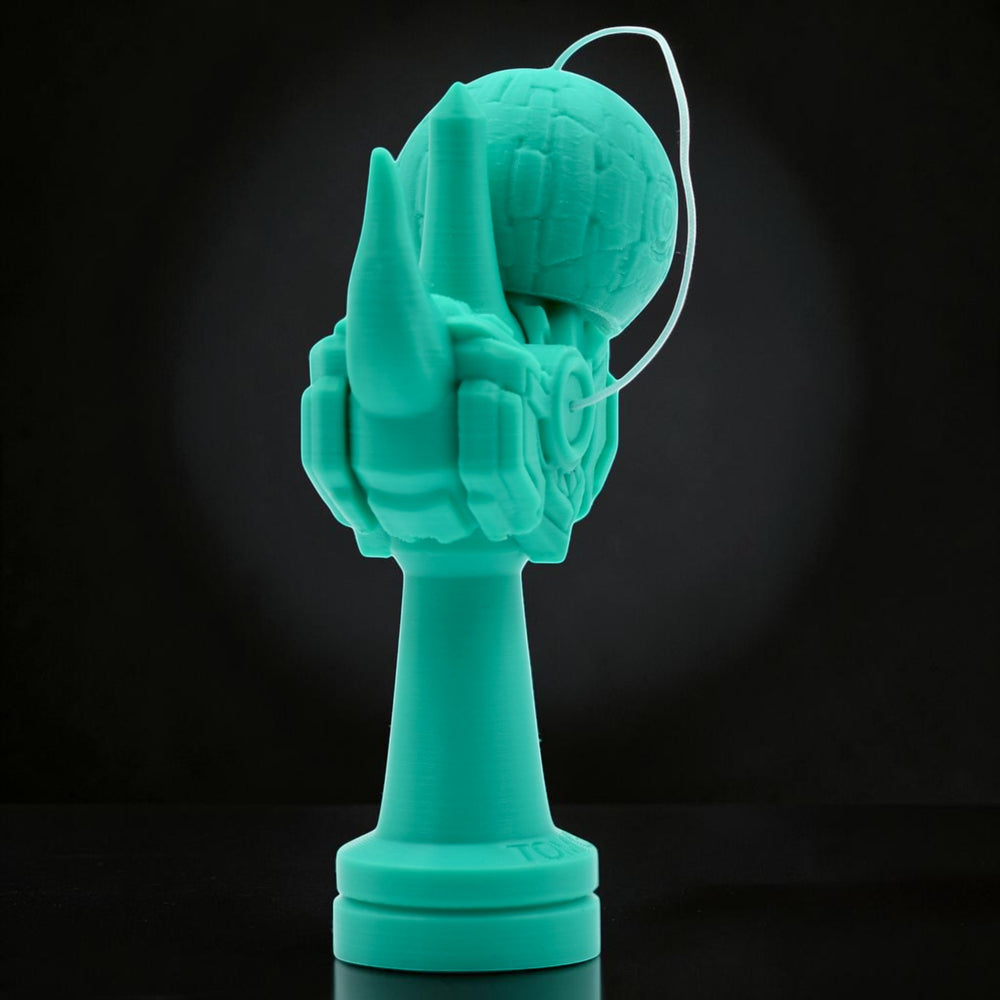Tom Go Kendama Geeker Iron M, a teal kendama with a unique, armored design and a textured ball.