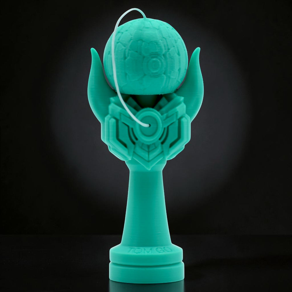 Teal Kendama Geeker Iron M with intricate design, featuring a textured tama and a stylized handle. Tom GO.