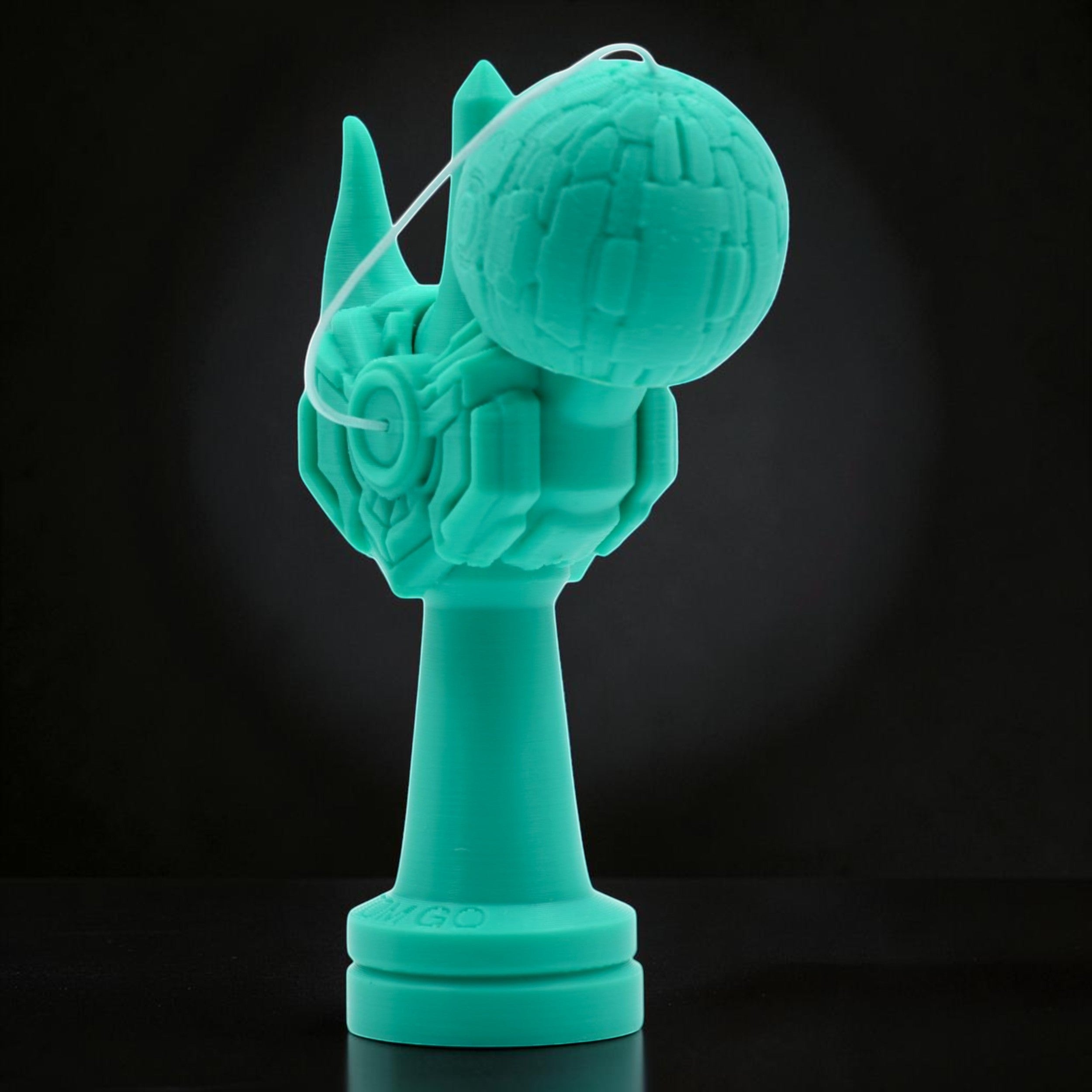 Tom GO Kendama Geeker Iron M, a teal kendama with a unique, armored design and a textured ball.