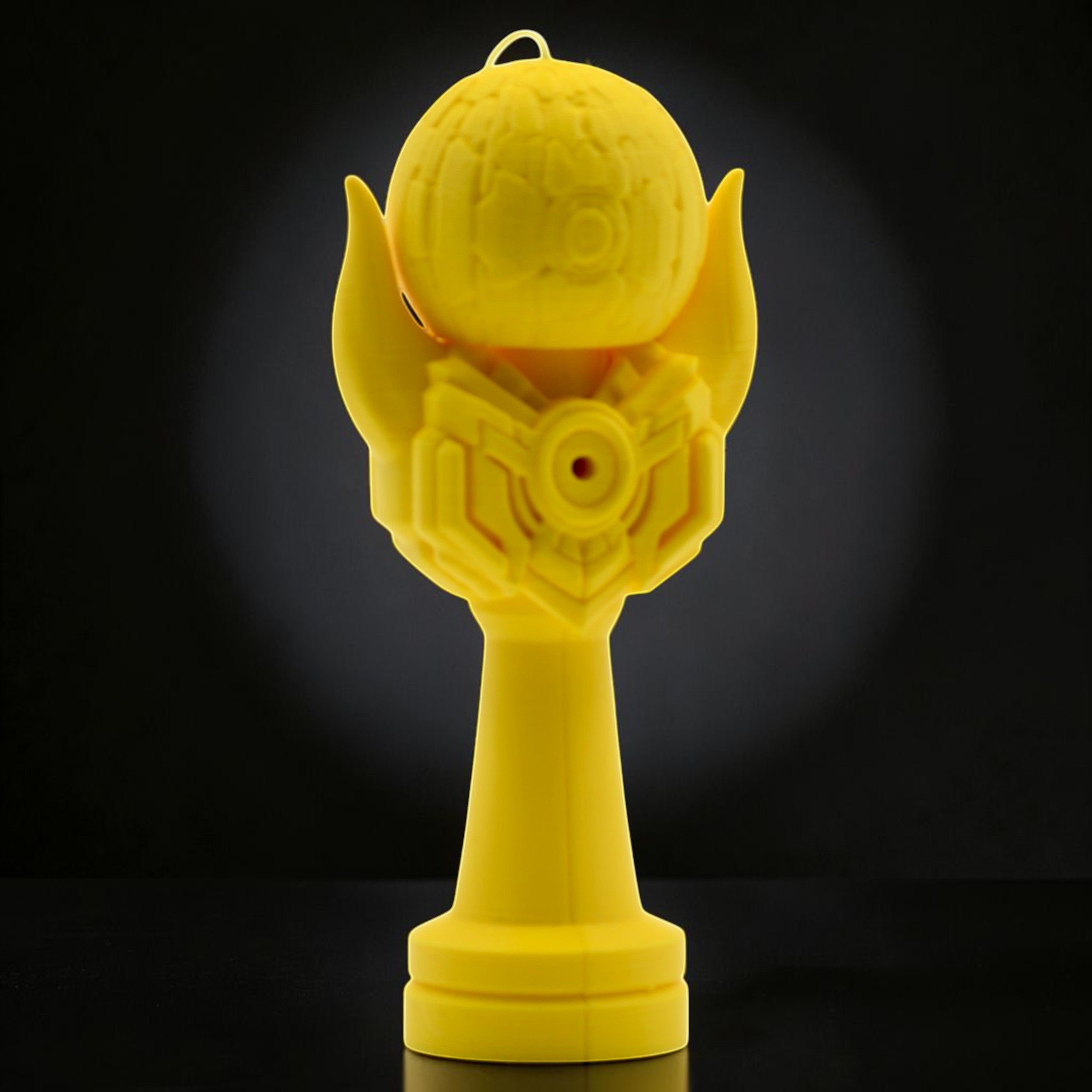 Tom GO Kendama Geeker Iron M, a bright yellow kendama with a unique armored design and textured tama.