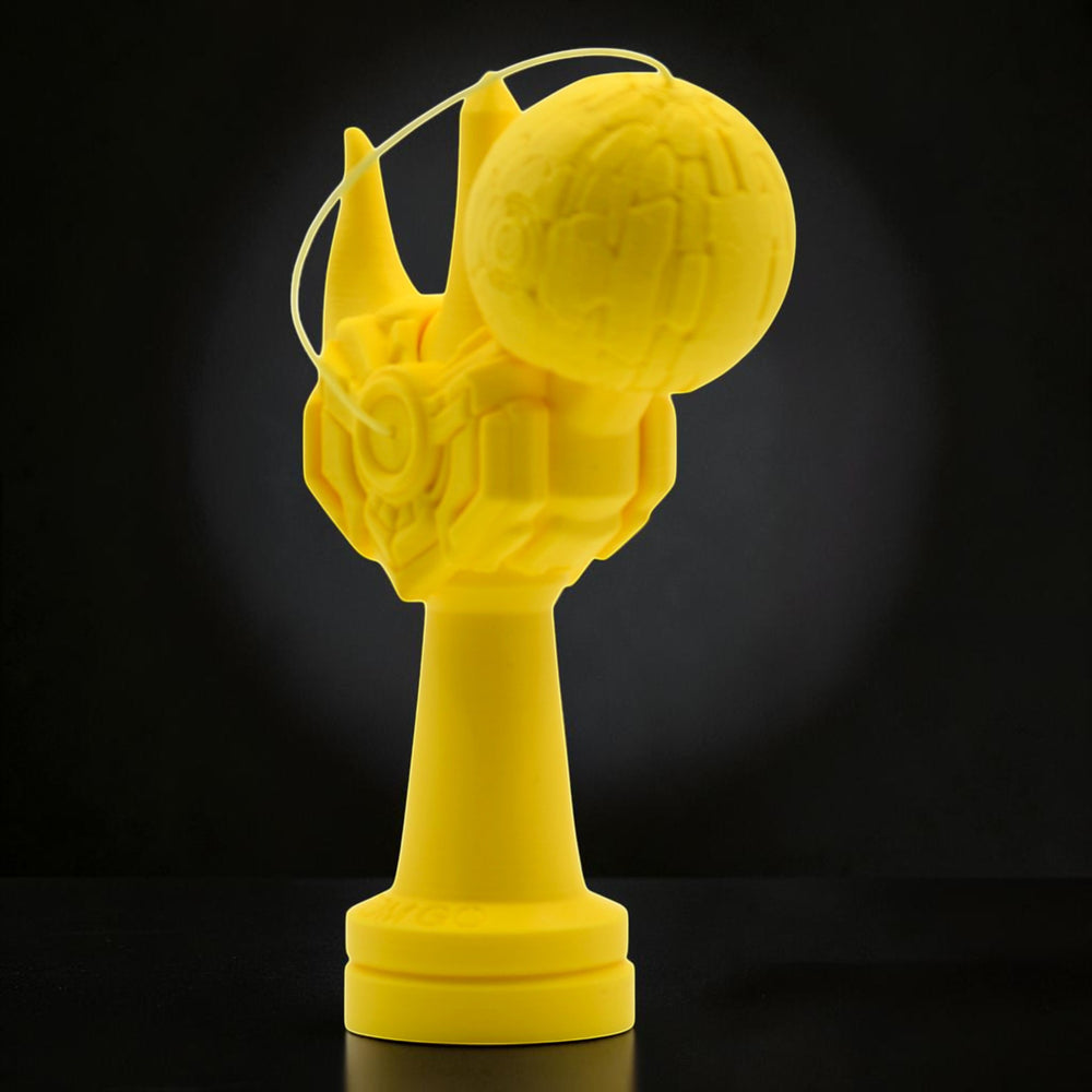 Tom GO Kendama Geeker Iron M, a bright yellow kendama with a unique, armored design and textured ball.