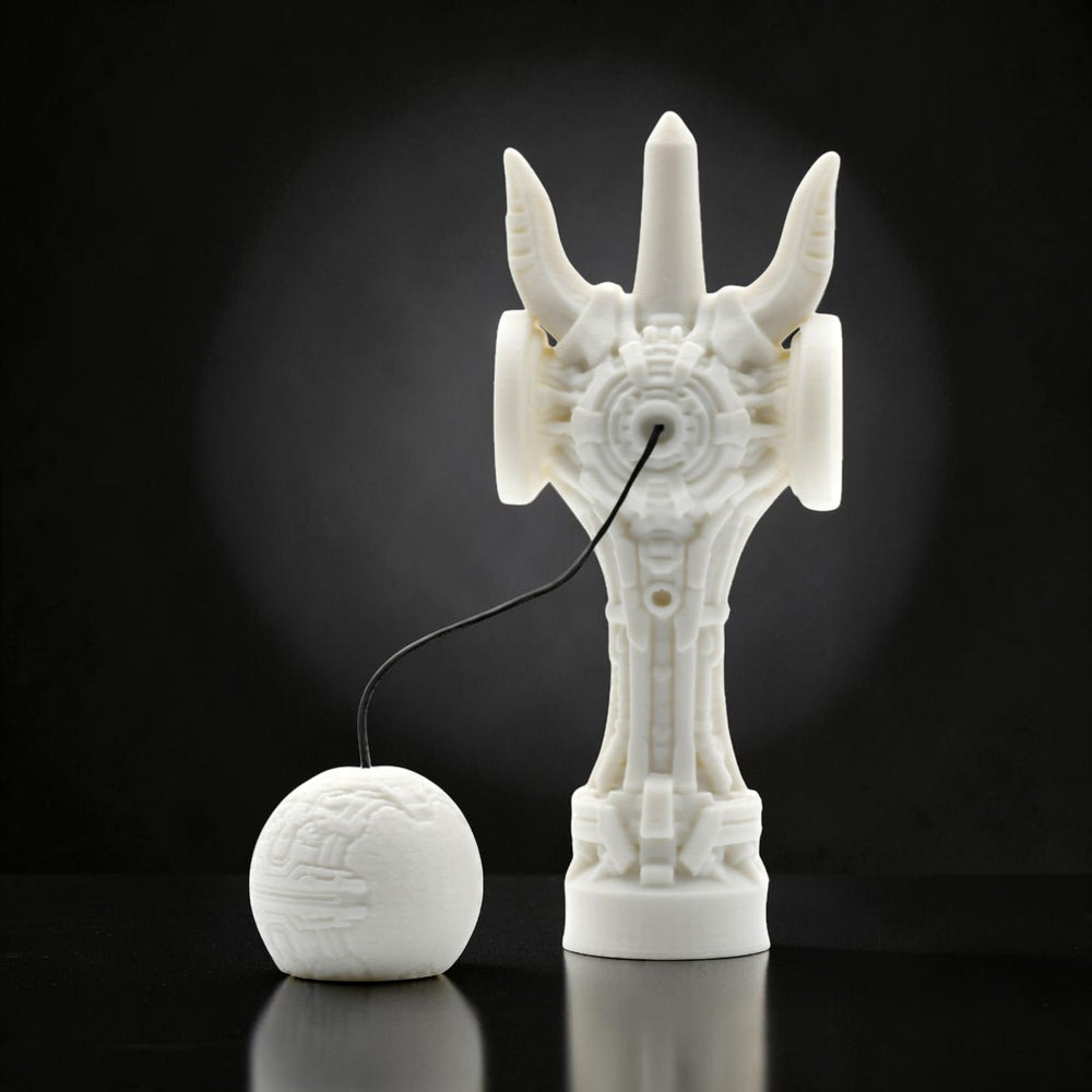 Tom GO white futuristic kendama with intricate geometric design and a spherical tama.