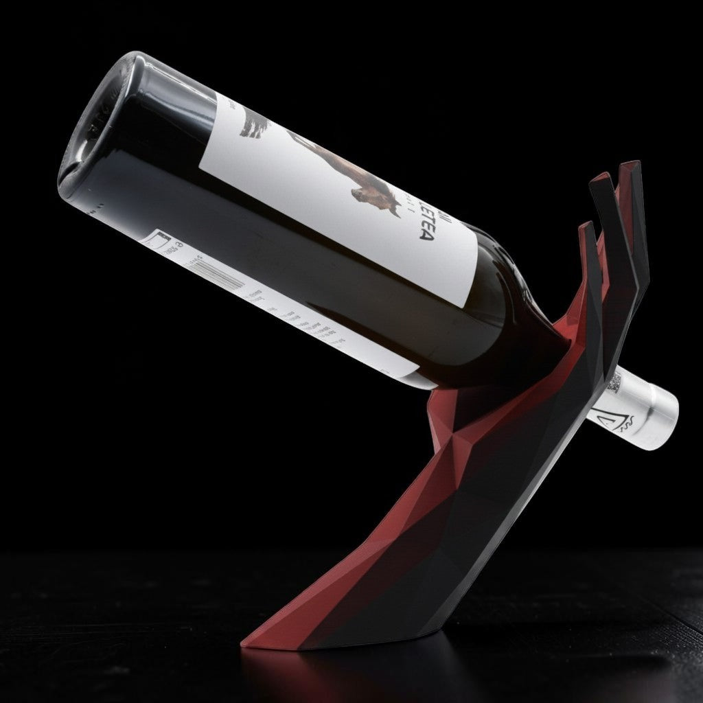 Tom GOH Modern Geometric Wine Bottle Holder Stand in black and red acrylic, shaped like a hand.