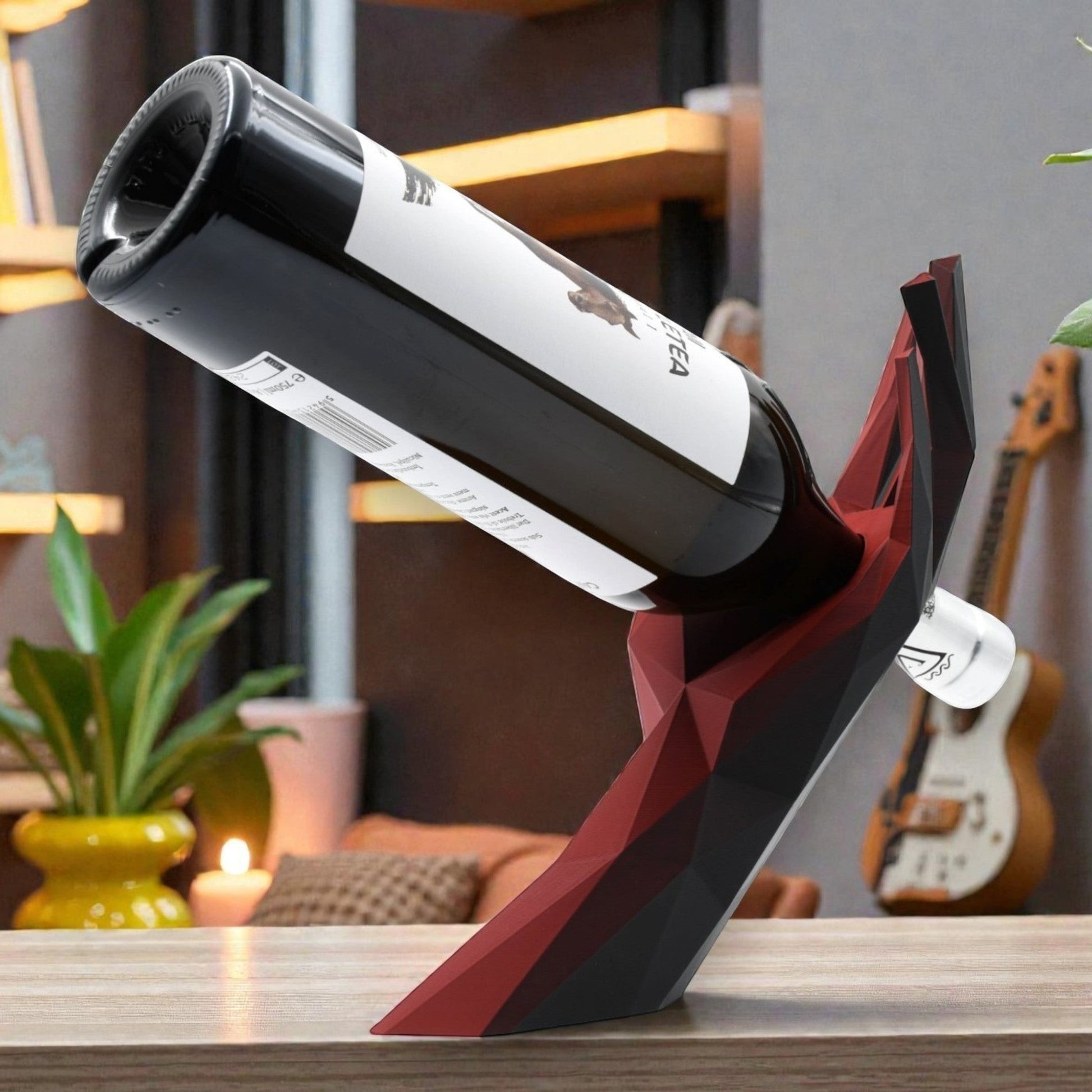 Tom GOH Modern Geometric Wine Bottle Holder Stand in black and red acrylic, shaped like a hand.